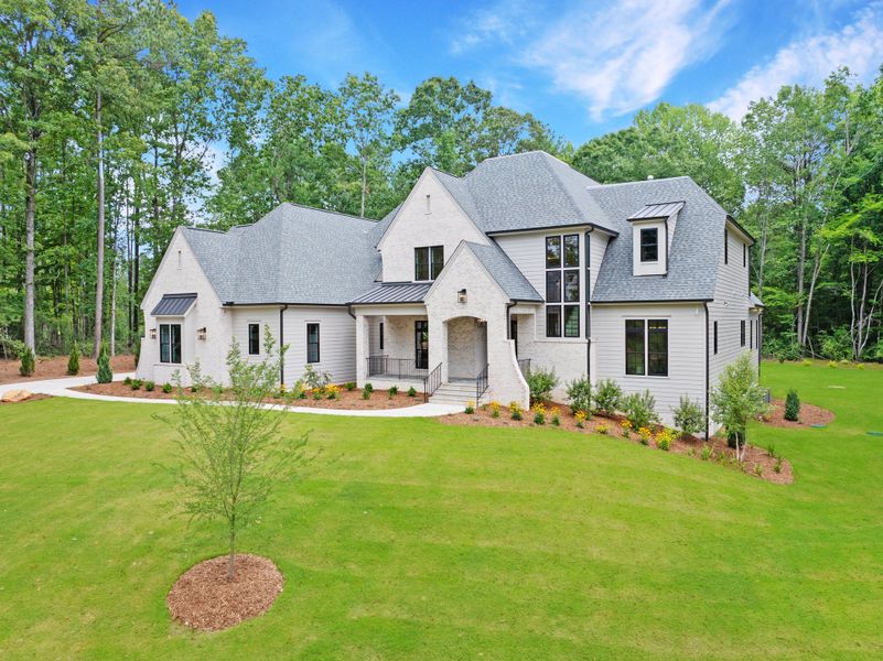 Front exterior of a new home in Corbett Landing, Pittsboro, NC, highlighting curb appeal (Image 5). Front exterior of a new home in Corbett Landing, Pittsboro, NC, highlighting curb appeal (Image 5).
