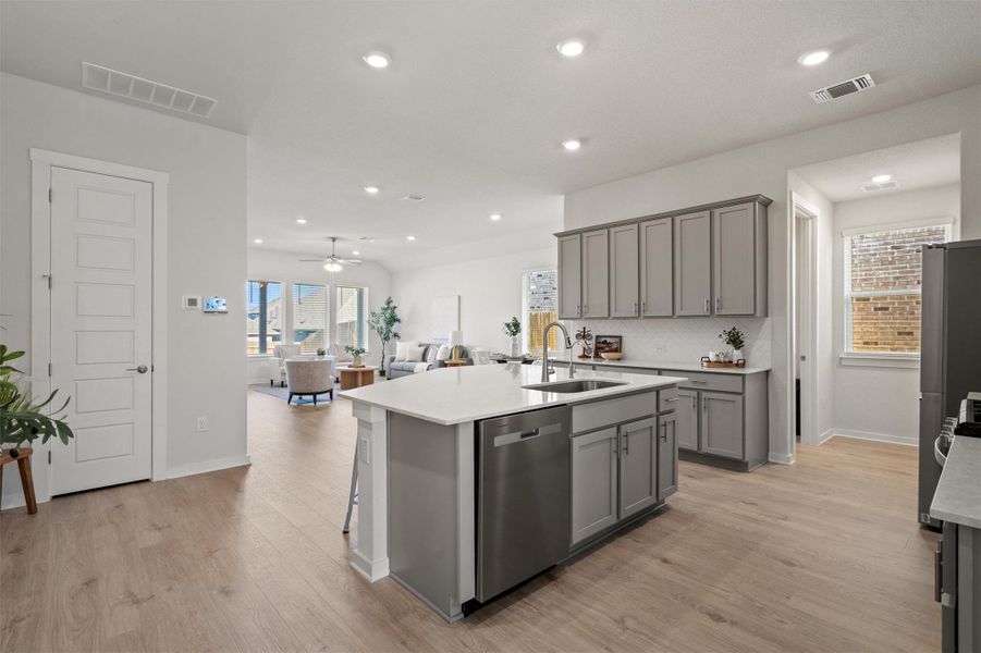 Wood plank flooring, large kitchen island Wood plank flooring, large kitchen island