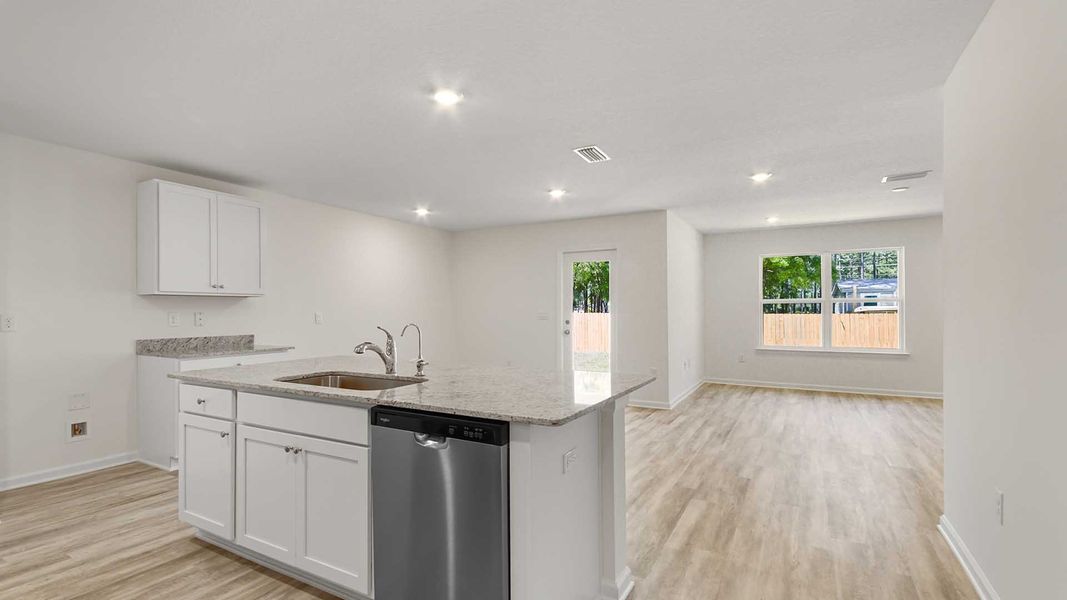 Furnished interior view inside a new home in Ashton Park Phase III, Freeport (Image 4).