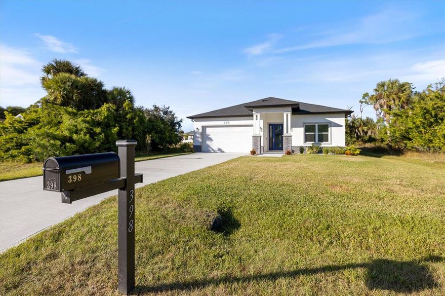 Front exterior of a new home in , Rotonda West, FL, highlighting curb appeal (Image 24).