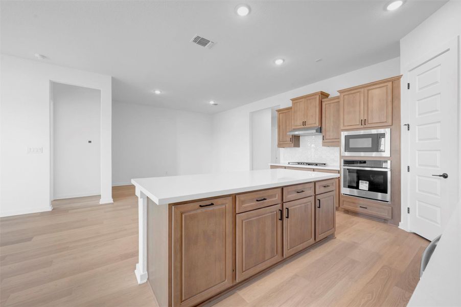 Furnished interior view inside a new home in Heritage, Dripping Springs (Image 6).