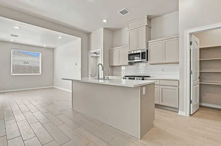 Furnished interior view inside a new home in Desert Breeze, Horizon City (Image 9).