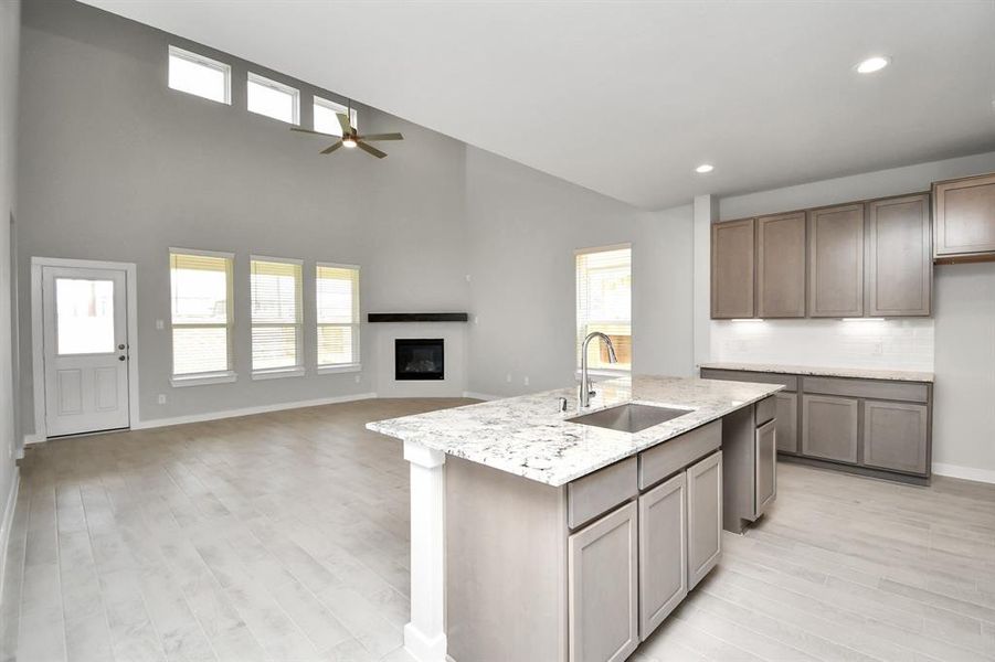 Step into a dream realized with this generously spacious kitchen! Sample photo, as built color and selections will vary.