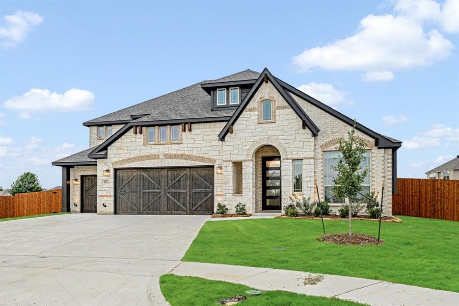 Front exterior of a new home in Sunrise at Garden Valley 60-79, Waxahachie, TX, highlighting curb appeal (Image 27).