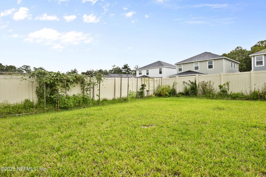 Front exterior of a new home in , St. Johns, FL, highlighting curb appeal (Image 1).