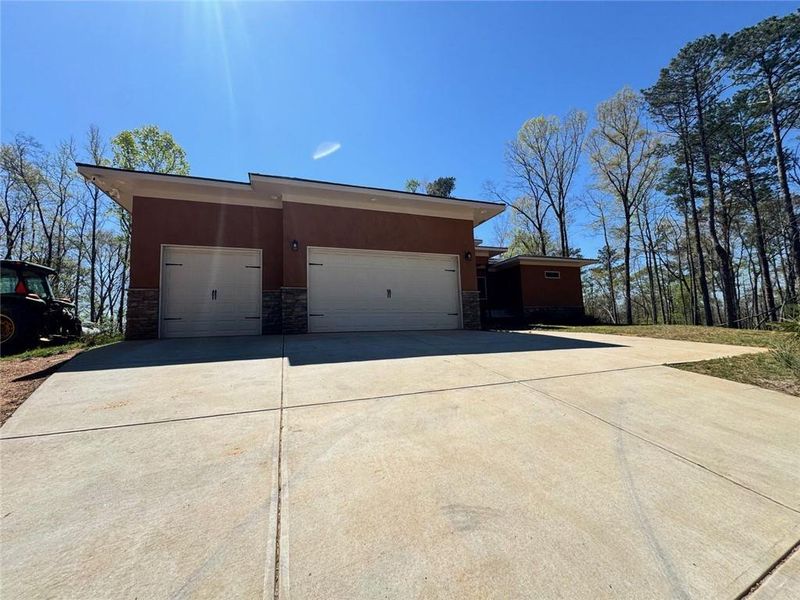 Front exterior of a new home in , Douglasville, GA, highlighting curb appeal (Image 1). Front exterior of a new home in , Douglasville, GA, highlighting curb appeal (Image 1).
