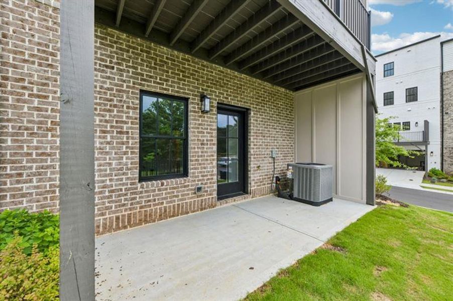Exterior details and patio area of a home in Skyview On Broad, Sugar Hill (Image 29).