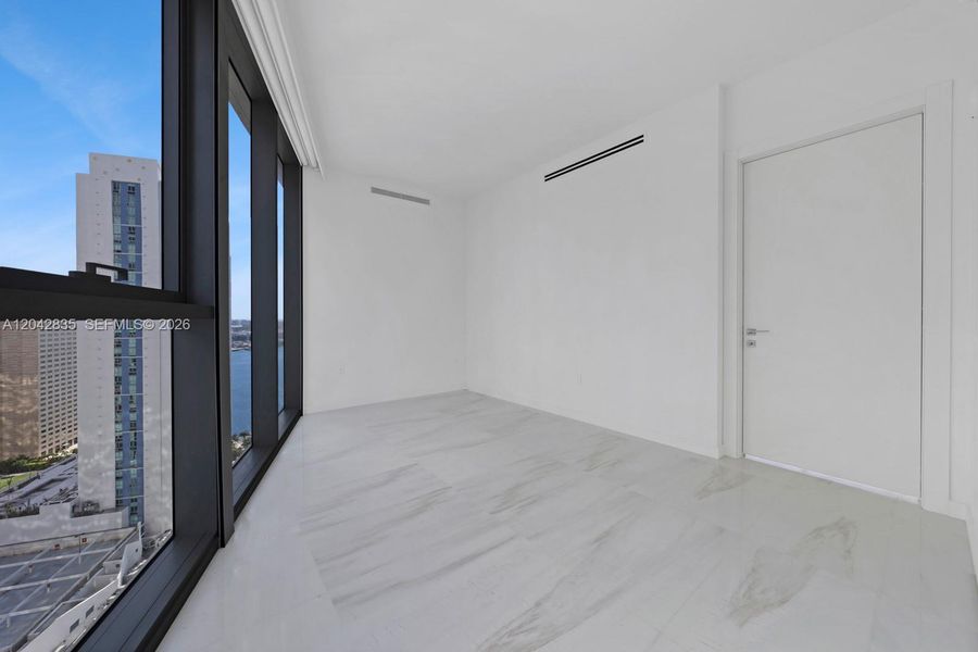 Spacious, unfurnished interior of a new home in Aston Martin Residences, Miami (Image 37).