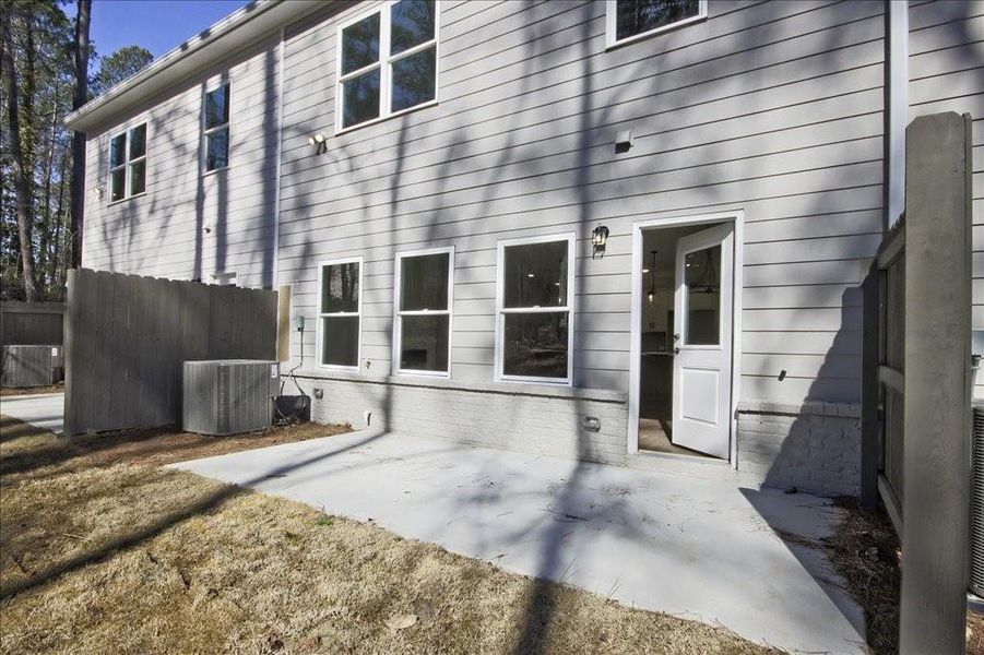 Front exterior of a new home in River Walk Place, Lawrenceville, GA, highlighting curb appeal (Image 18).