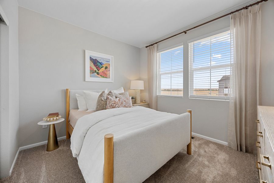 Representative furnished interior of a home built from the 2504 by Risewell Homes in Harvest Crossing, Aurora (Image 12).