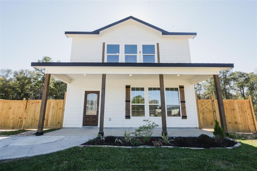 Front exterior of a new home in , Conroe, TX, highlighting curb appeal (Image 16).