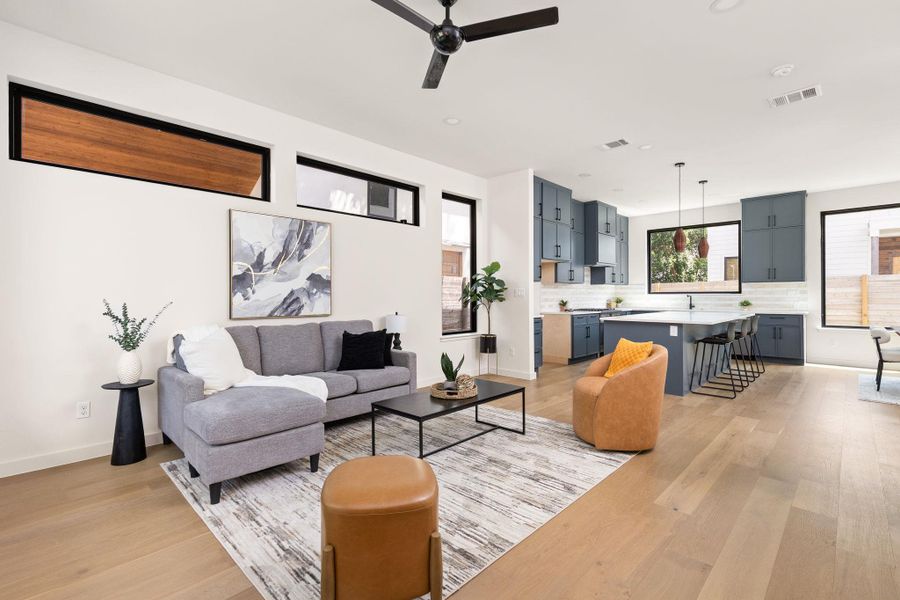 An open floorplan seamlessly connects the airy living space and gourmet kitchen.