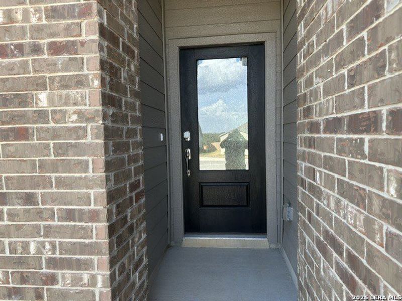 Exterior details and patio area of a home in Juniper Ranch, Spring Branch (Image 16).