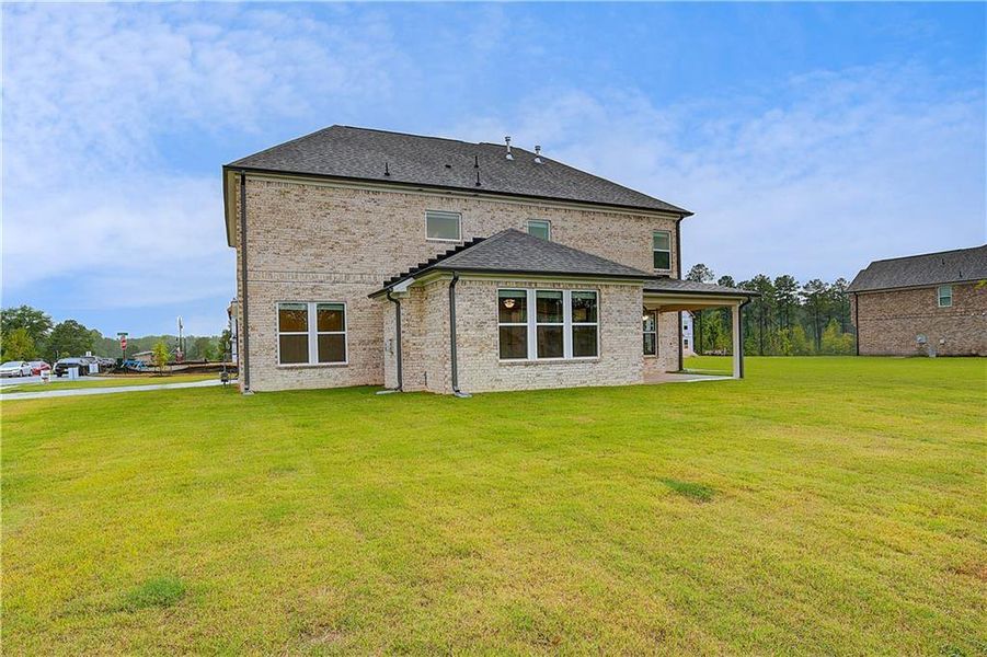 Front exterior of a new home in Westwind Estates, Hampton, GA, highlighting curb appeal (Image 16).
