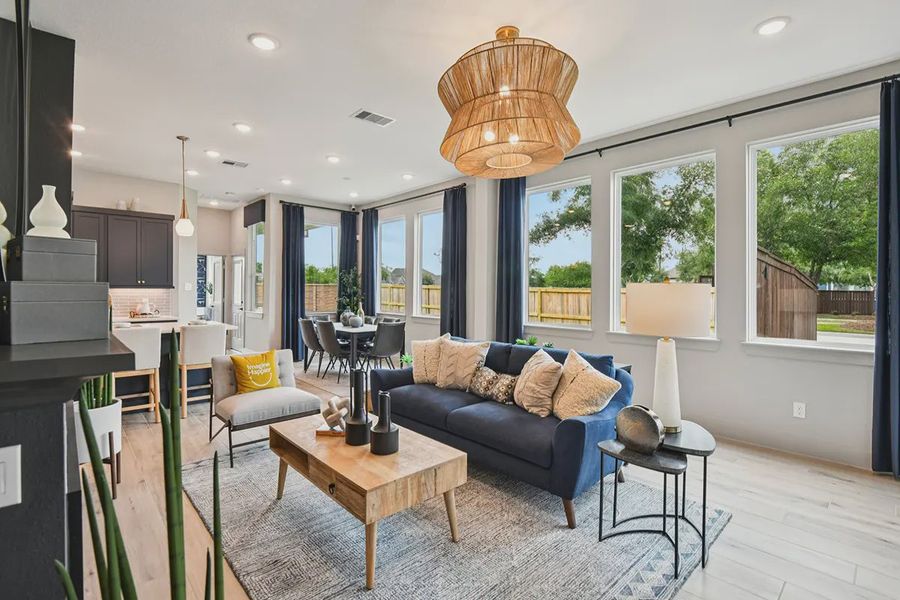 Furnished interior view inside a new home in Meridiana Chateau, Manvel (Image 16).