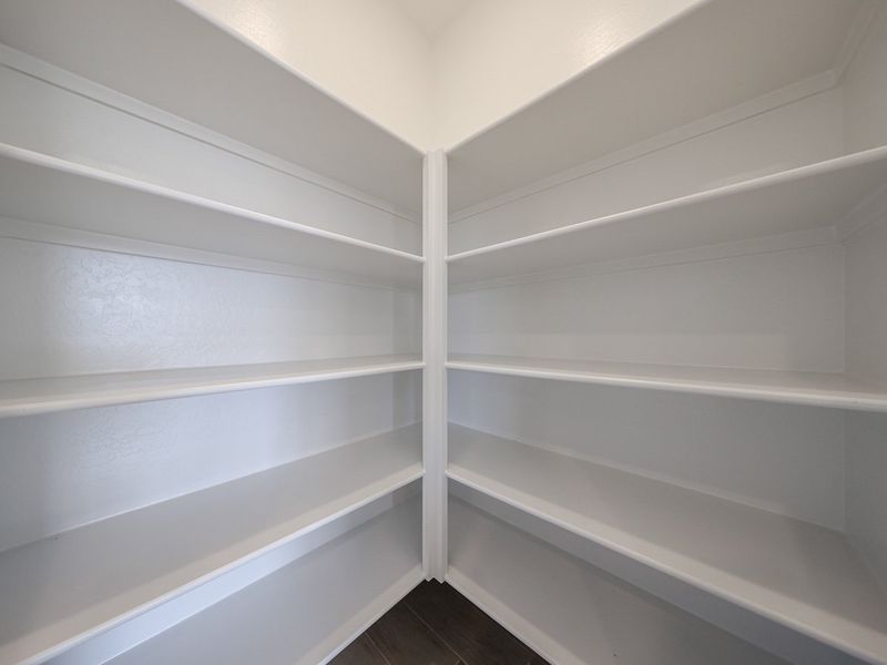 A white shelf with white shelves. A white shelf with white shelves.