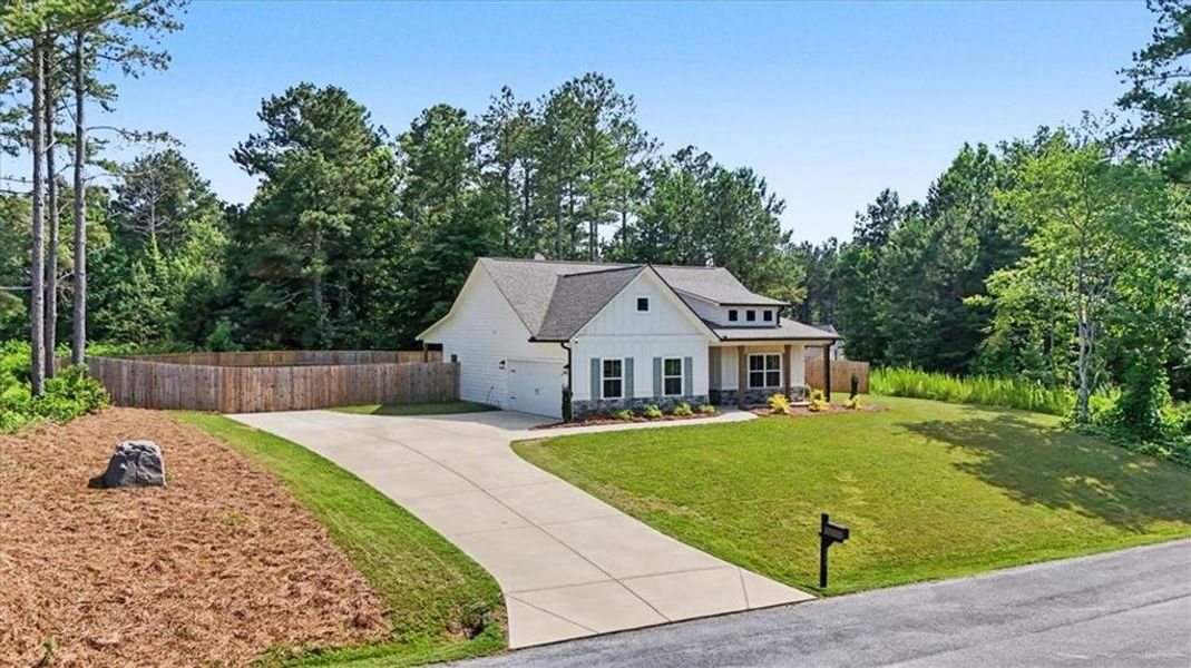 Front exterior of a new home in , Dallas, GA, highlighting curb appeal (Image 22).