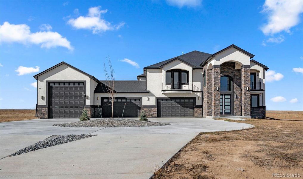 Front exterior of a new home in , Hudson, CO, highlighting curb appeal (Image 26).