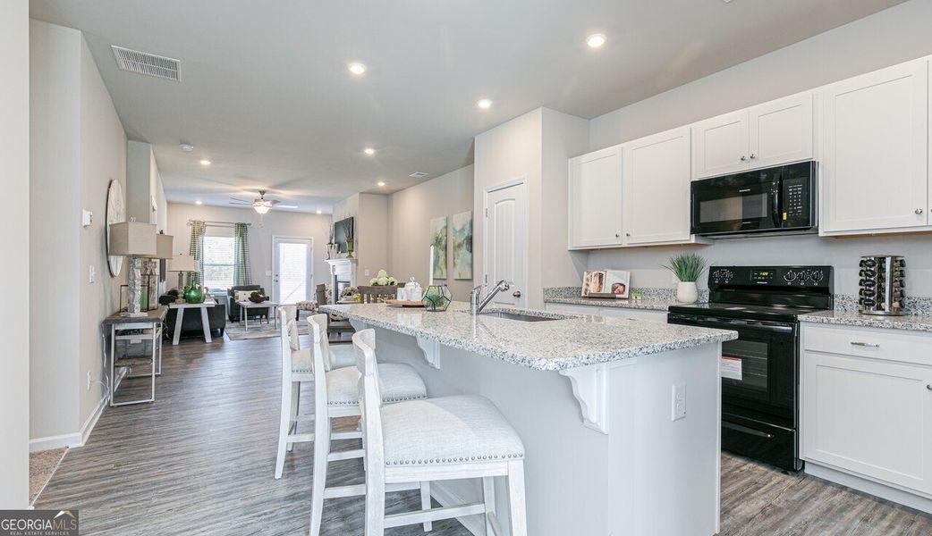 Furnished interior view inside a new home in The Cottages of Silvertown, Thomaston (Image 9).
