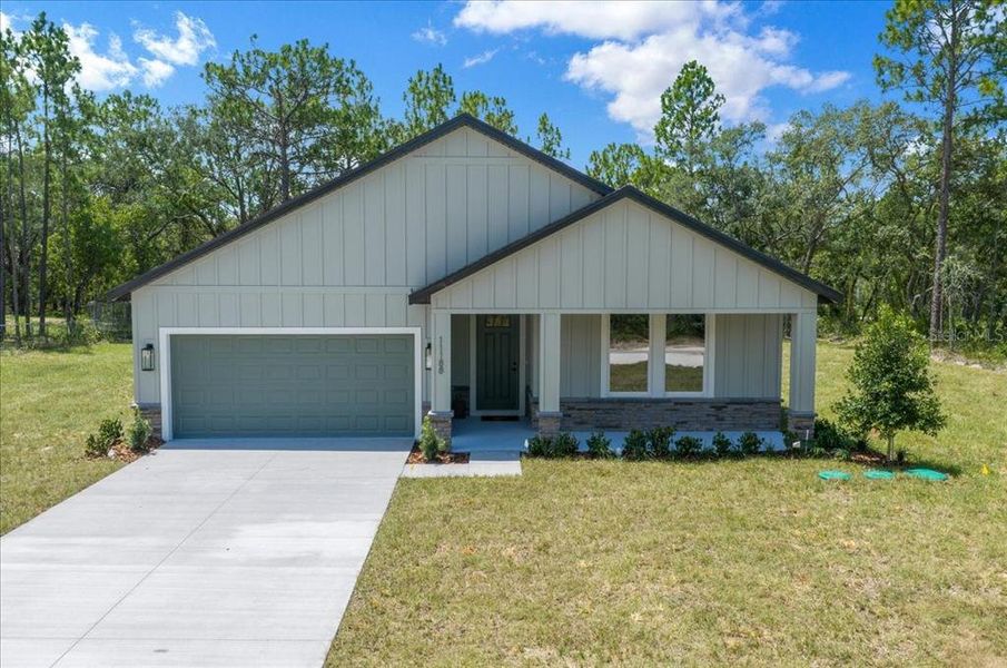 Front exterior of a new home in , Weeki Wachee, FL, highlighting curb appeal (Image 30). Front exterior of a new home in , Weeki Wachee, FL, highlighting curb appeal (Image 30).