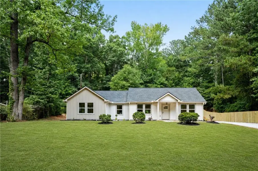 Front exterior of a new home in , Loganville, GA, highlighting curb appeal (Image 1). Front exterior of a new home in , Loganville, GA, highlighting curb appeal (Image 1).