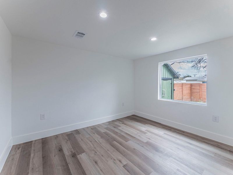 Unfurnished room featuring light wood-style floors and recessed lighting