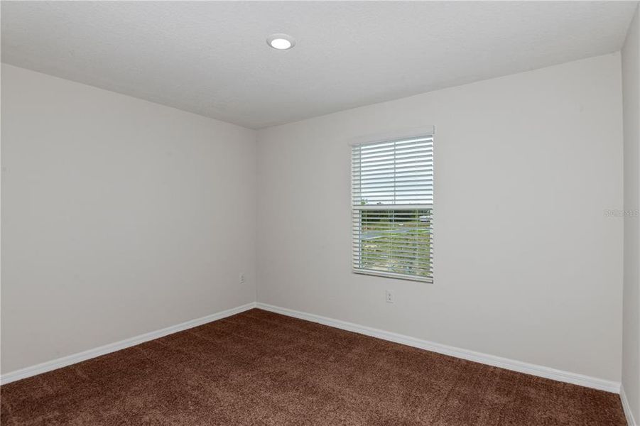 Spacious, unfurnished interior of a new home in Grove at Crosswind, Haines City (Image 16).