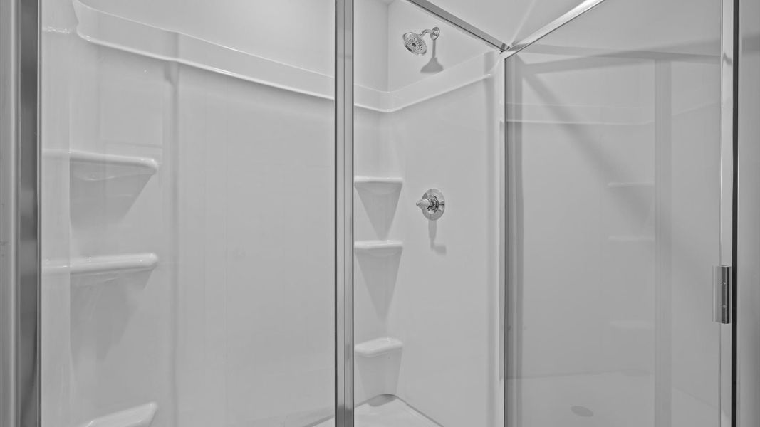 First-rate primary bathroom offering an elegant walk-in shower and dual sinks with superior style First-rate primary bathroom offering an elegant walk-in shower and dual sinks with superior style