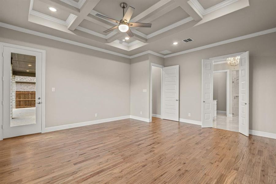 Unfurnished bedroom with recessed lighting, light wood-style floors, coffered ceiling, a chandelier, and beam ceiling