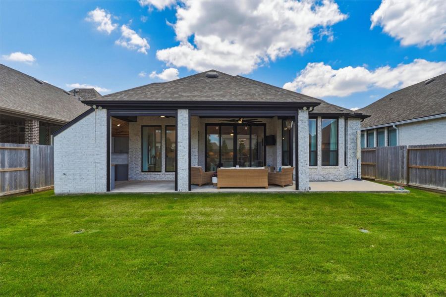 Exterior details and patio area of a home in , Brookshire (Image 33).