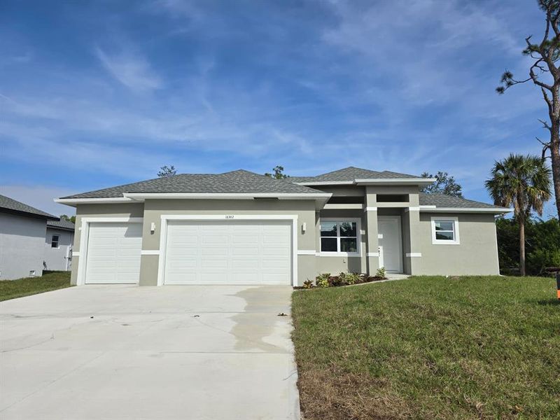 Front exterior of a new home in , Port Charlotte, FL, highlighting curb appeal (Image 1). Front exterior of a new home in , Port Charlotte, FL, highlighting curb appeal (Image 1).