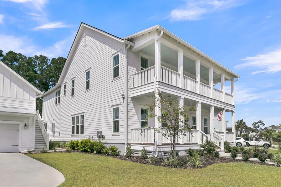 Front exterior of a new home in Carolina Park: Riverside, Mount Pleasant, SC, highlighting curb appeal (Image 21). Front exterior of a new home in Carolina Park: Riverside, Mount Pleasant, SC, highlighting curb appeal (Image 21).