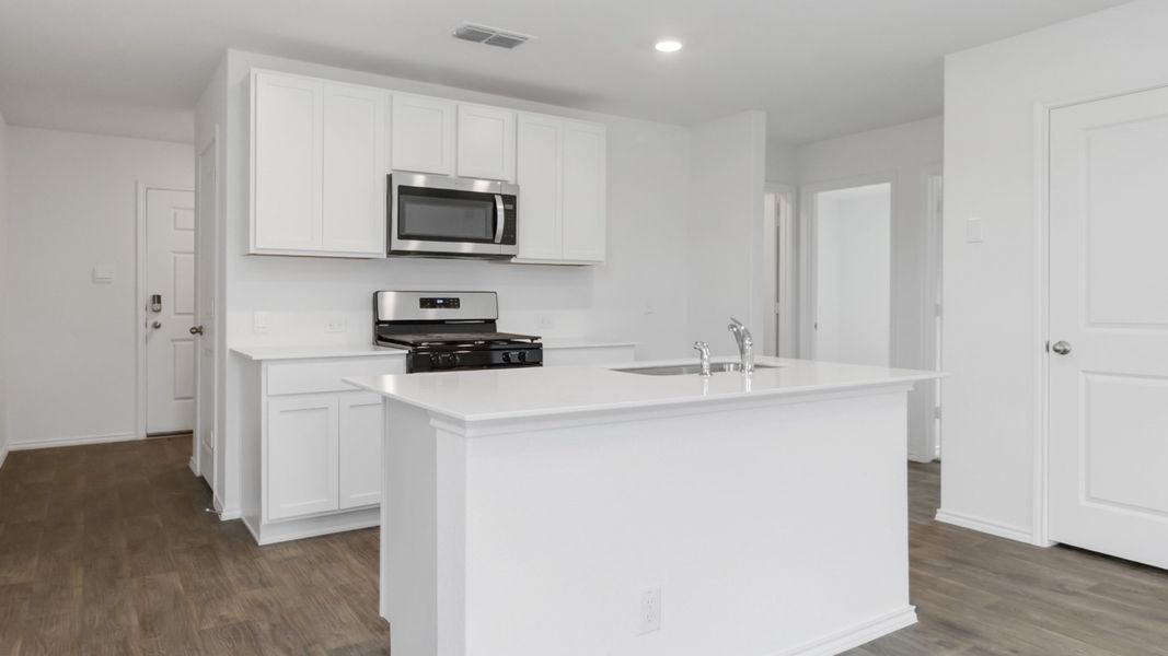 Representative furnished interior of a home built from the T30B Barton by D.R. Horton in Riverfield, Josephine (Image 6).