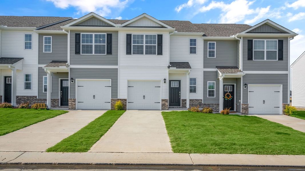 Front exterior of a new home in The Townes at Prestleigh, Wake Forest, NC, highlighting curb appeal (Image 2). Front exterior of a new home in The Townes at Prestleigh, Wake Forest, NC, highlighting curb appeal (Image 2).