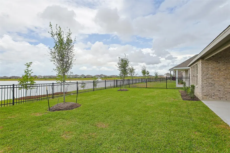 Exterior details and patio area of a home in Sunterra, Katy (Image 20). Exterior details and patio area of a home in Sunterra, Katy (Image 20).