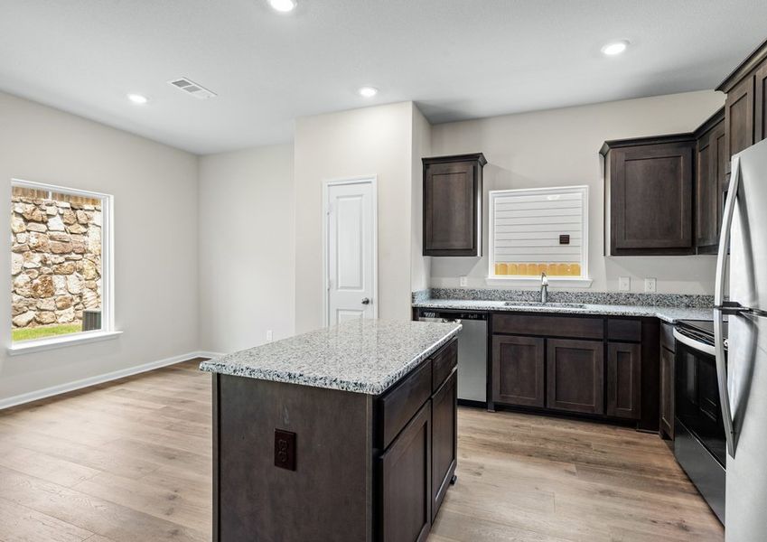 The dining room sits adjacent to the kitchen. The dining room sits adjacent to the kitchen.