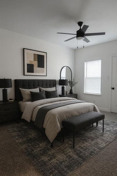 Carpeted bedroom featuring a ceiling fan