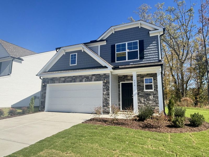 Front exterior of a new home in Daniel Farms, Benson, NC, highlighting curb appeal (Image 2).