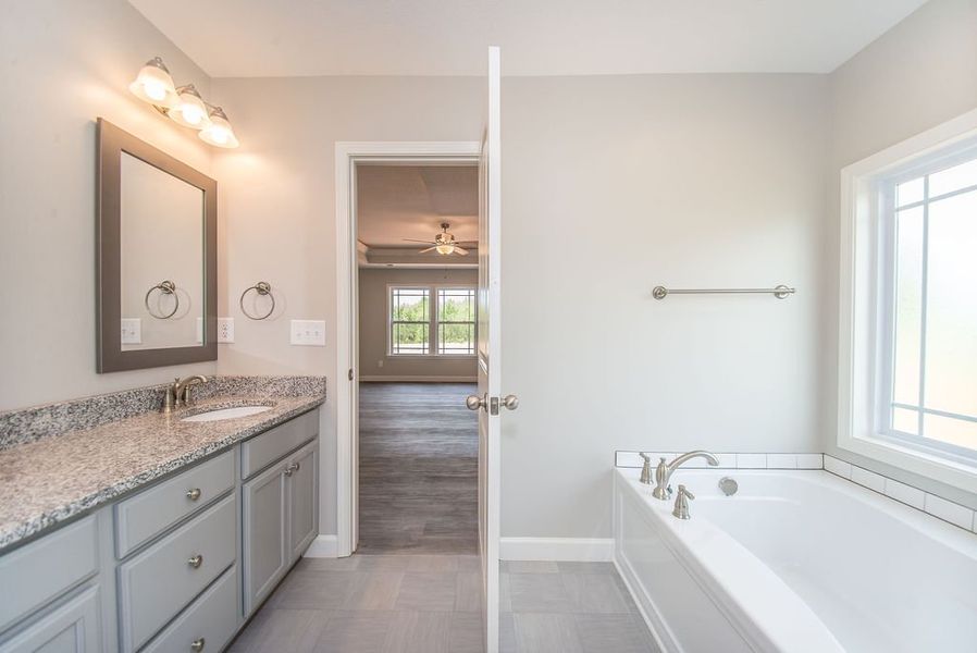 Representative furnished interior of a home built from the Beaumont by Enchanted Homes in Guadalupe Heights, Seguin (Image 19).