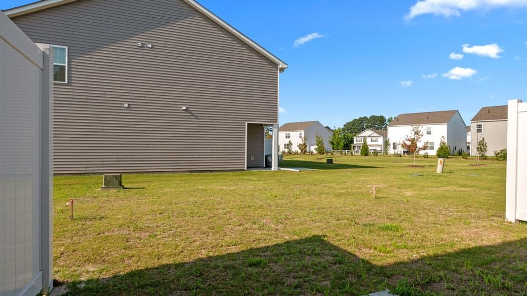 Exterior details and patio area of a home in The Townes at Ridgewood Farms, Winterville (Image 18).