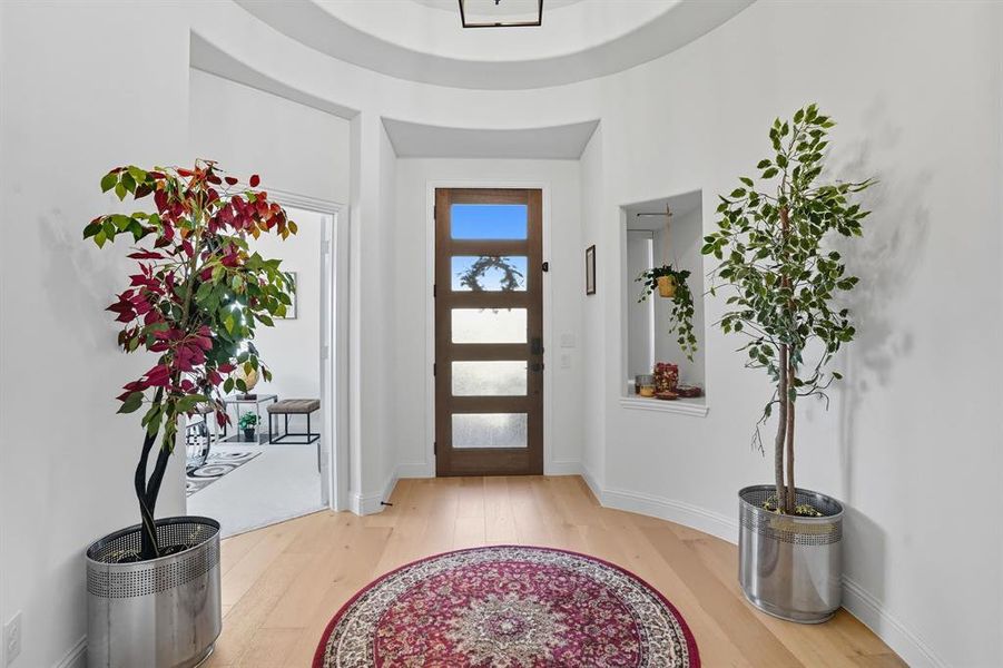 Entryway featuring light wood finished floors and baseboards
