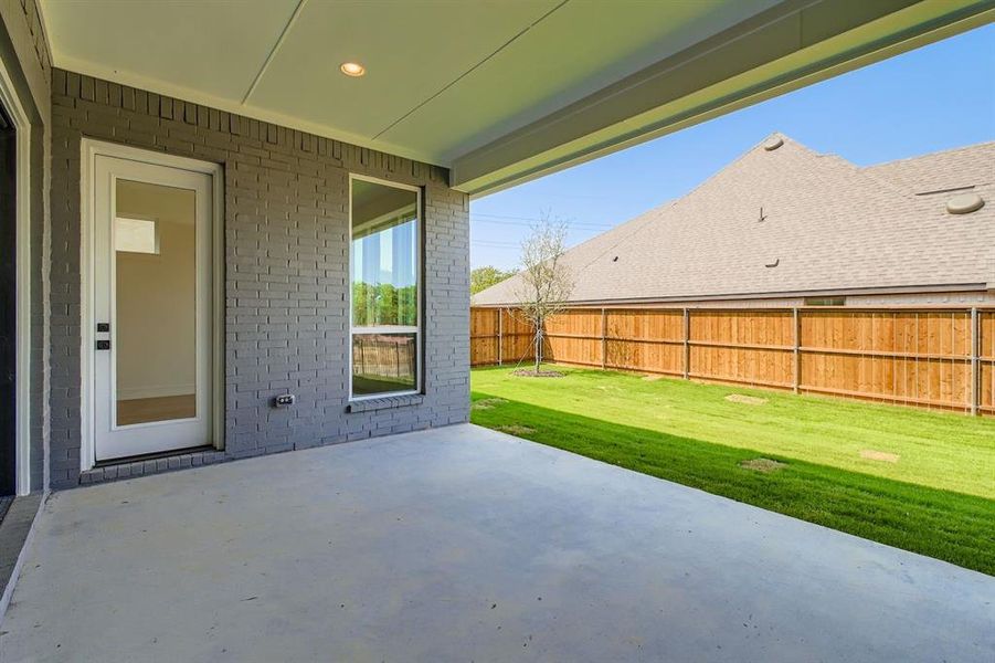 Fenced backyard featuring a patio Fenced backyard featuring a patio