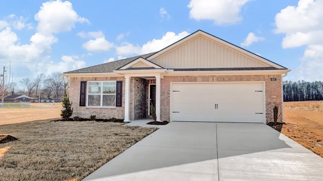 Front exterior of a new home in Riggs Pointe, Millington, TN, highlighting curb appeal (Image 2).