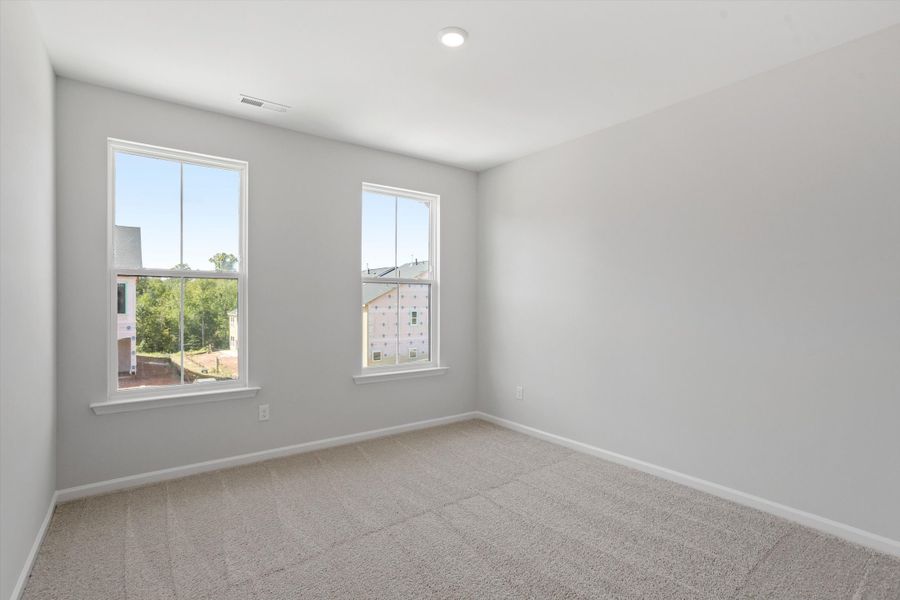 Spacious, unfurnished interior of a new home in Sweetbrier, Durham (Image 29).