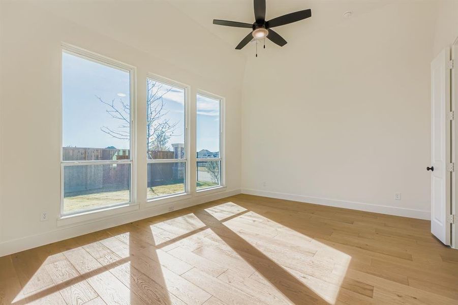 Unfurnished room with light wood-type flooring and ceiling fan
