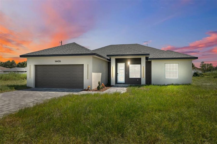 Front exterior of a new home in , Ocala, FL, highlighting curb appeal (Image 2). Front exterior of a new home in , Ocala, FL, highlighting curb appeal (Image 2).