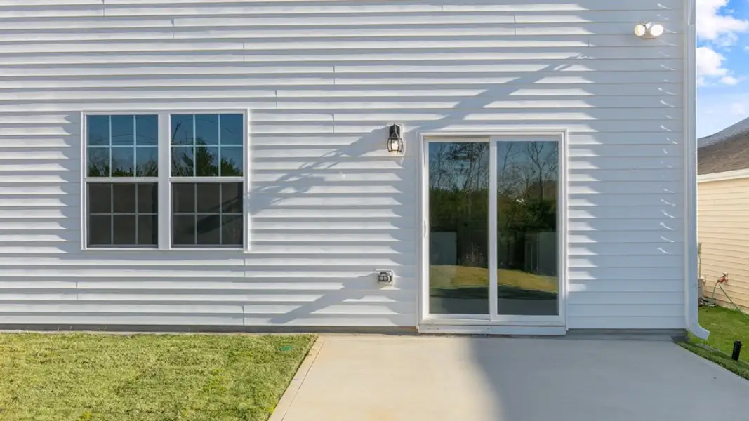 Exterior details and patio area of a home in East Ridge, Ayden (Image 2). Exterior details and patio area of a home in East Ridge, Ayden (Image 2).