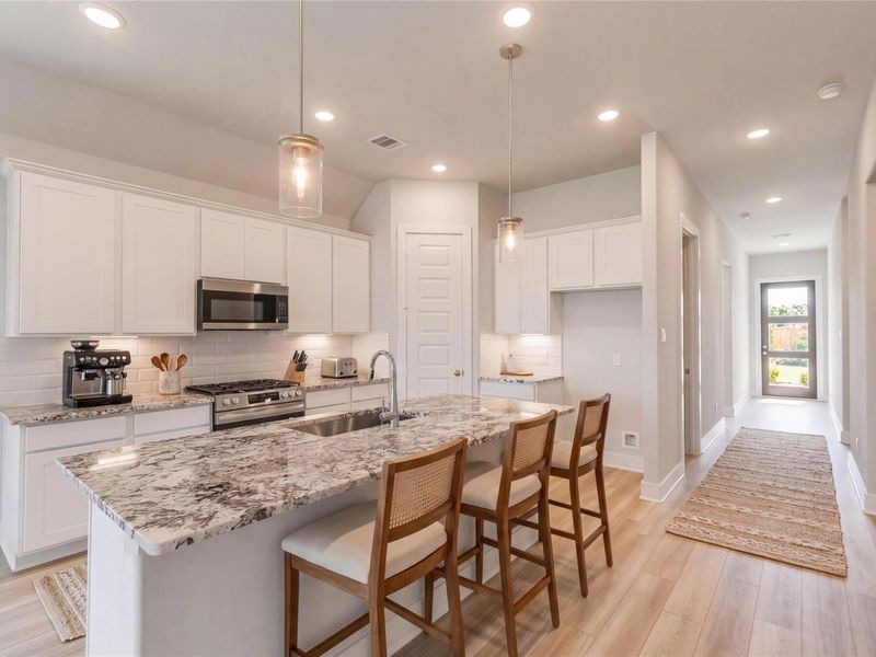 Furnished interior view inside a new home in Sunterra, Katy (Image 7).