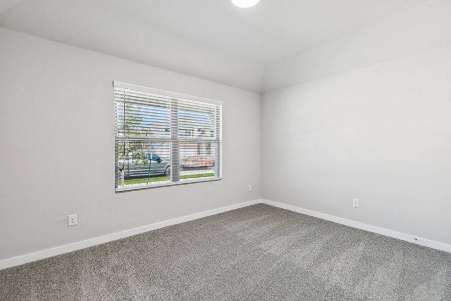 Bedroom in the Heisman home plan by Trophy Signature Homes – REPRESENTATIVE PHOTO Bedroom in the Heisman home plan by Trophy Signature Homes – REPRESENTATIVE PHOTO