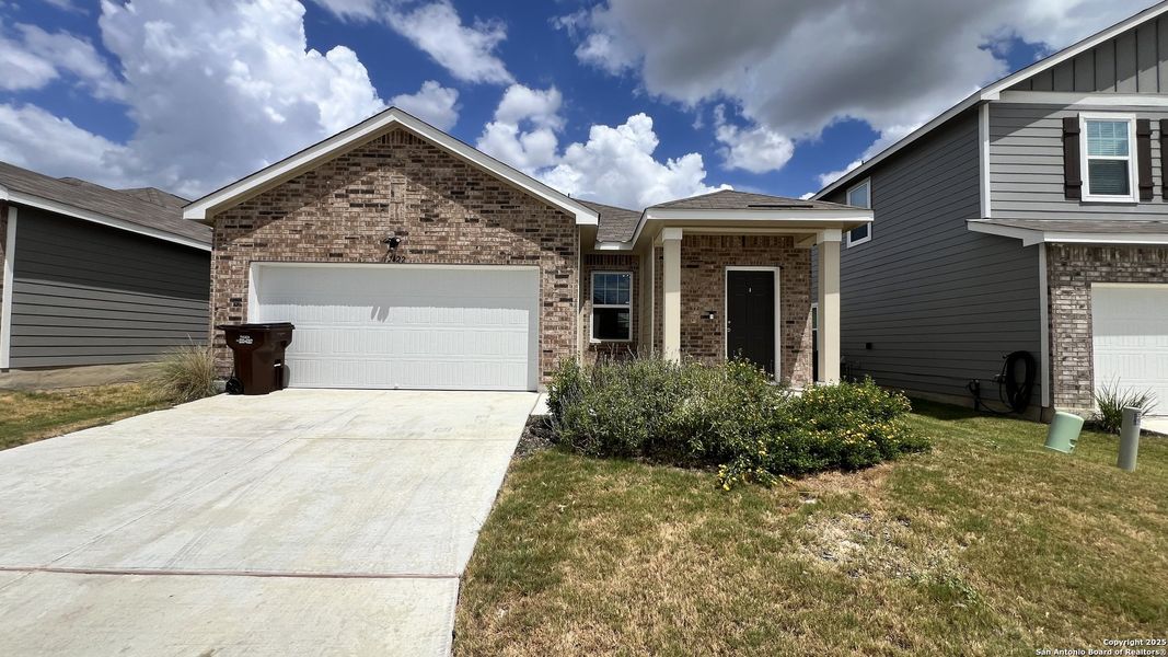 Front exterior of a new home in Trails at Culebra, San Antonio, TX, highlighting curb appeal (Image 16).